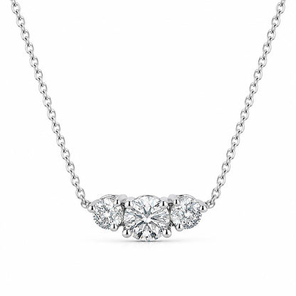 Platinum three-stone lab-grown diamond necklace isolated on white