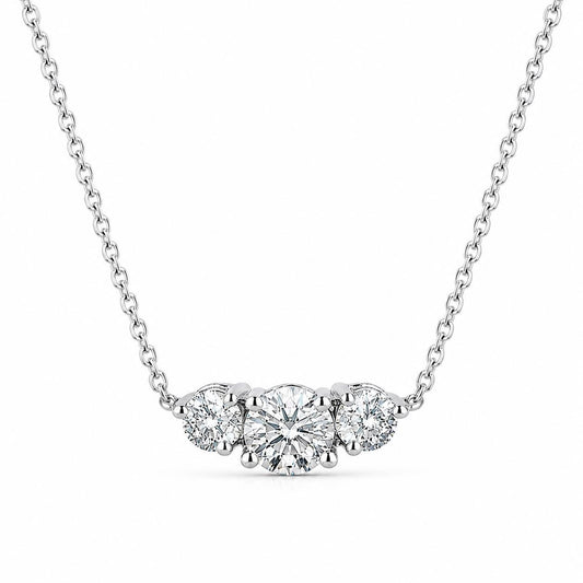 Platinum three-stone lab-grown diamond necklace isolated on white