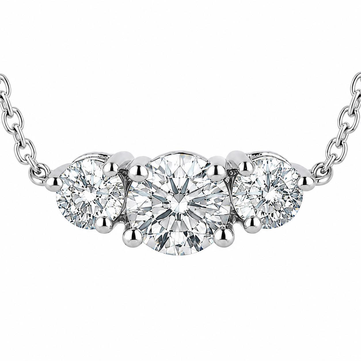 Macro front view of three round lab-grown diamonds in platinum