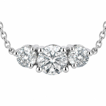 Macro front view of three round lab-grown diamonds in platinum