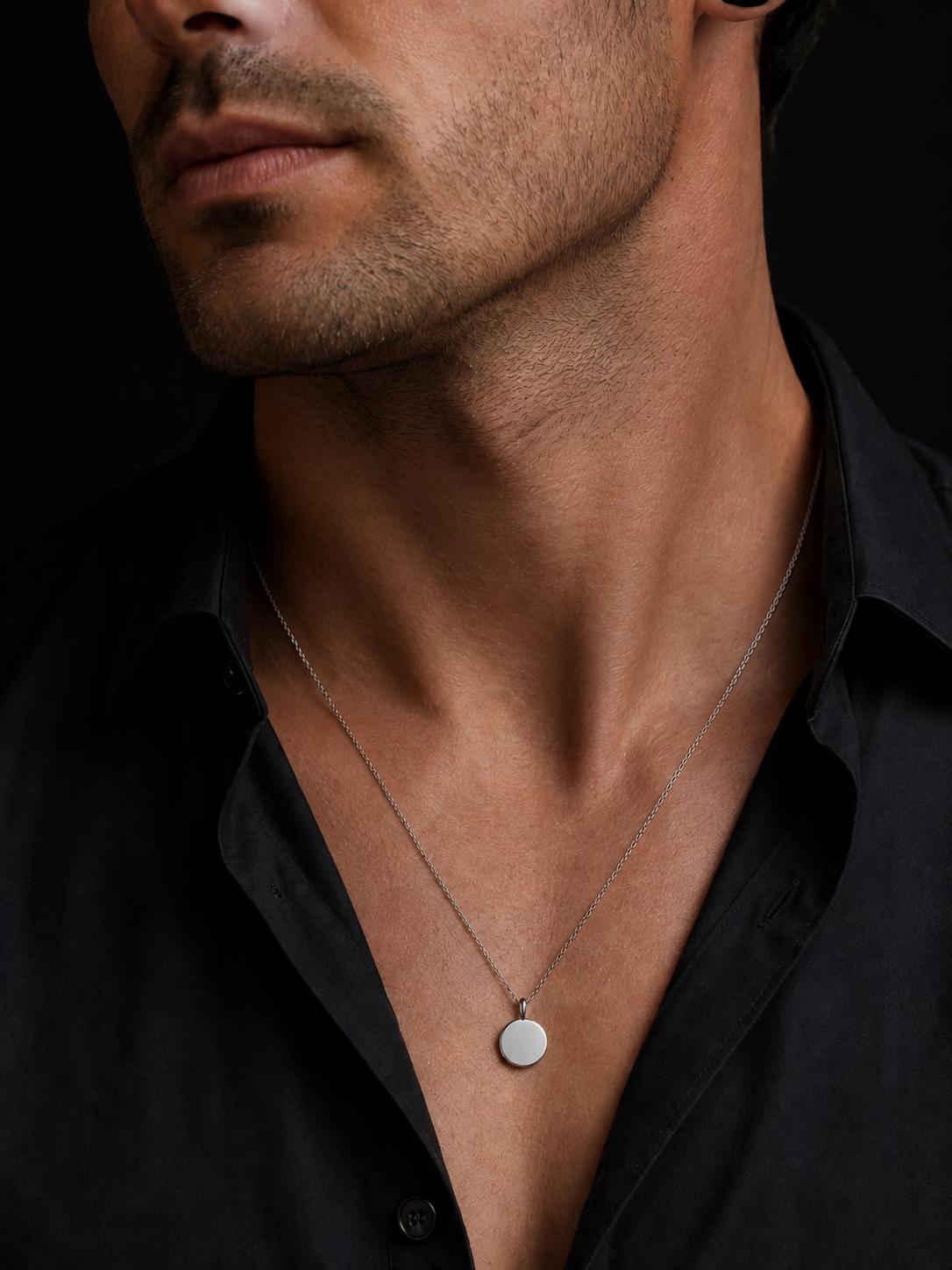 Man wearing 15mm platinum disc pendant necklace with black shirt