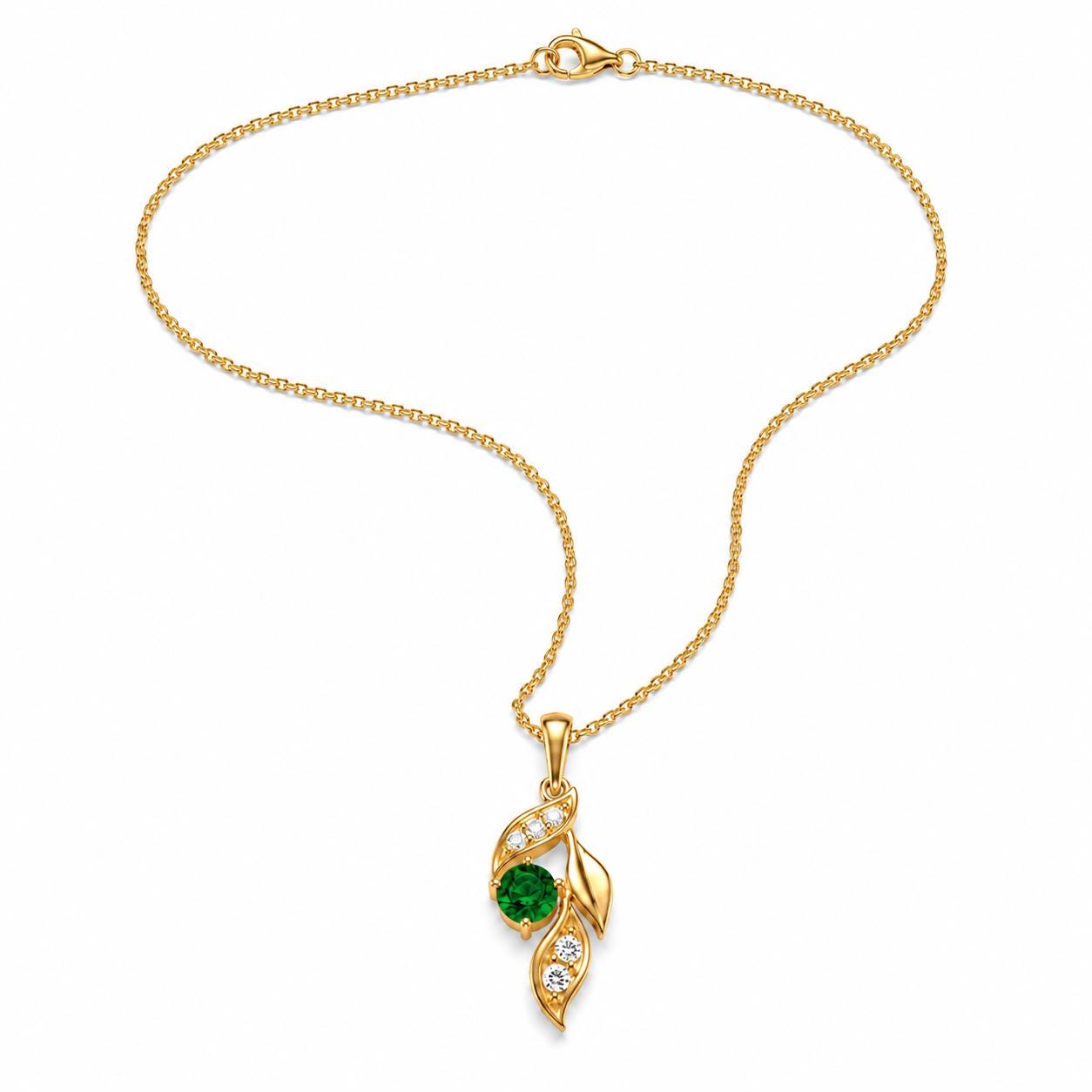 Emerald leaf necklace arranged in a flowing curve on white