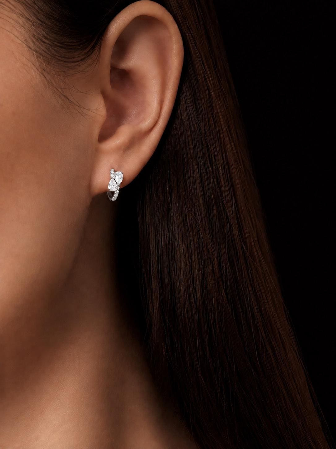 Model wearing PT950 pear cluster lab diamond huggie earrings
