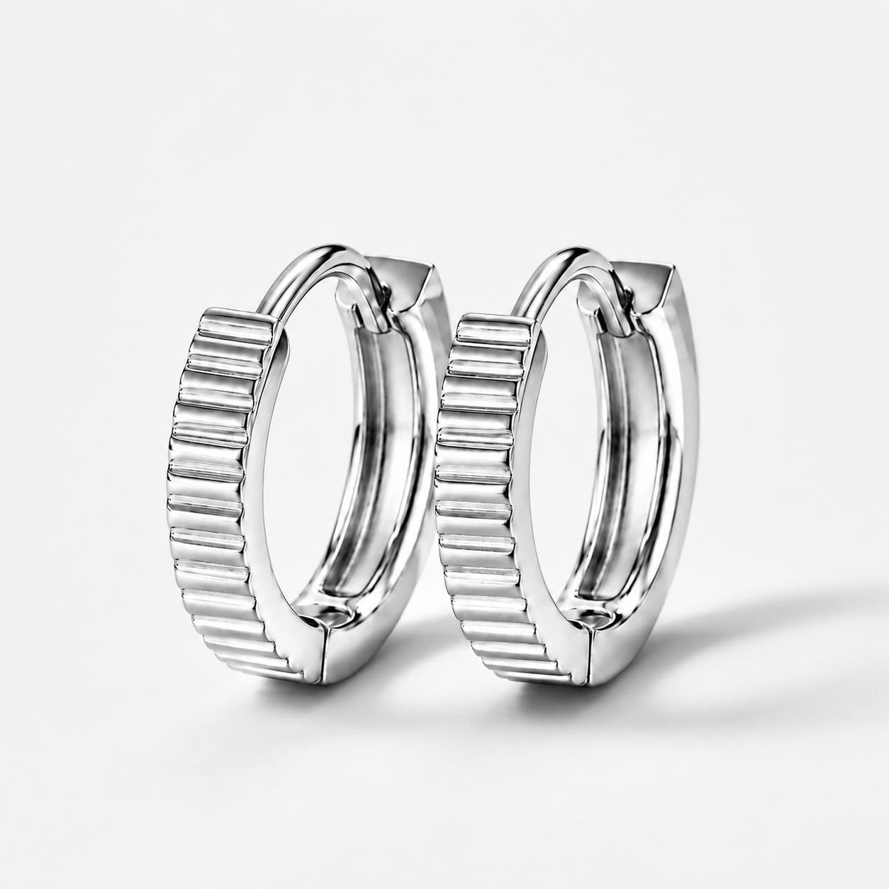 Front pair of solid PT950 ridged huggie hoop earrings