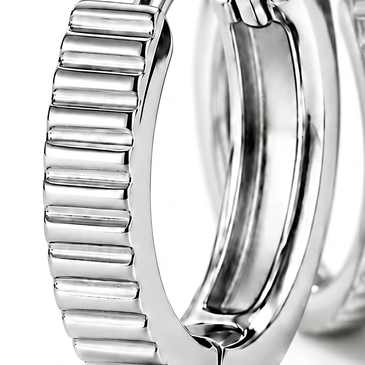 Macro view of ridged texture and clasp on a PT950 huggie hoop