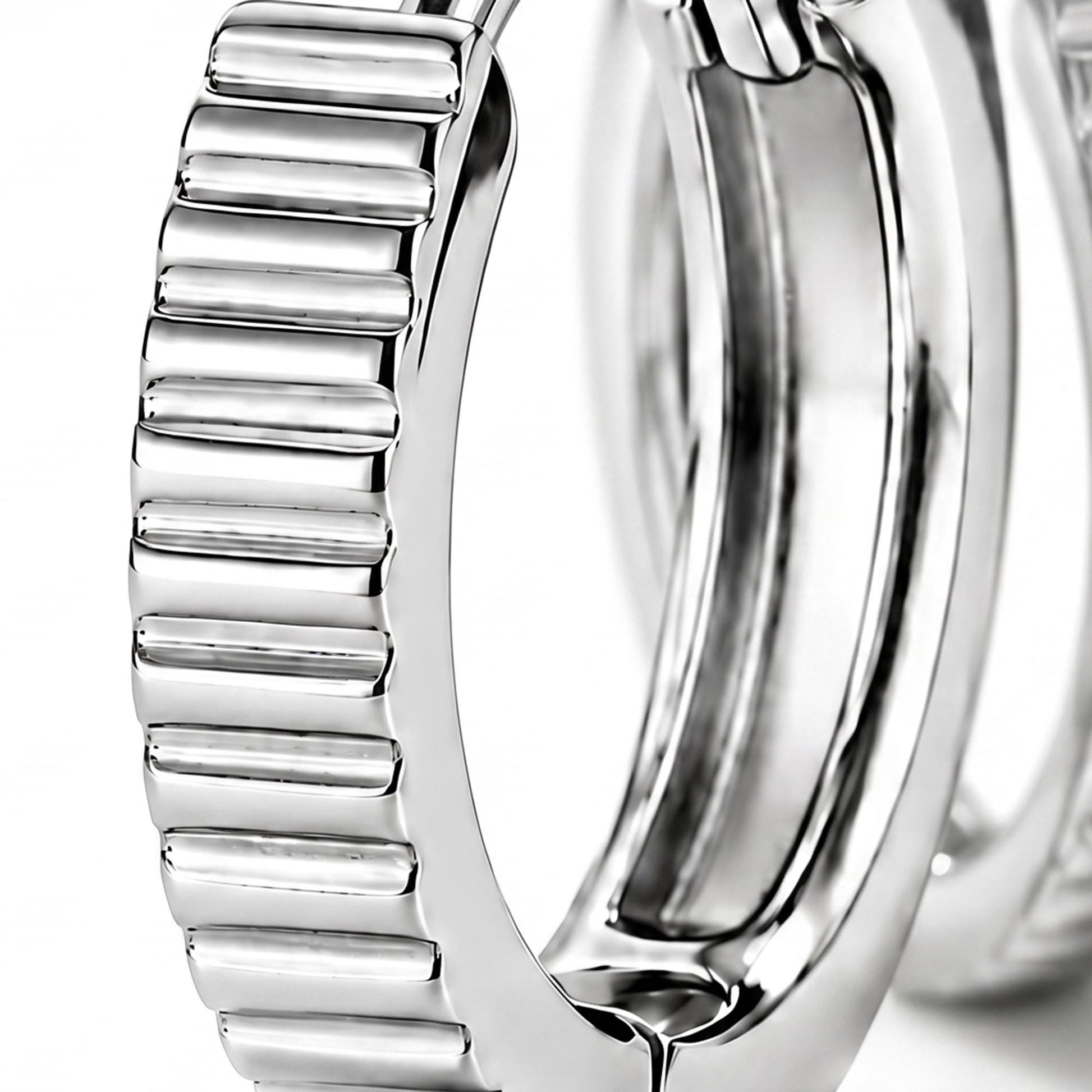 Macro view of ridged texture and clasp on a PT950 huggie hoop