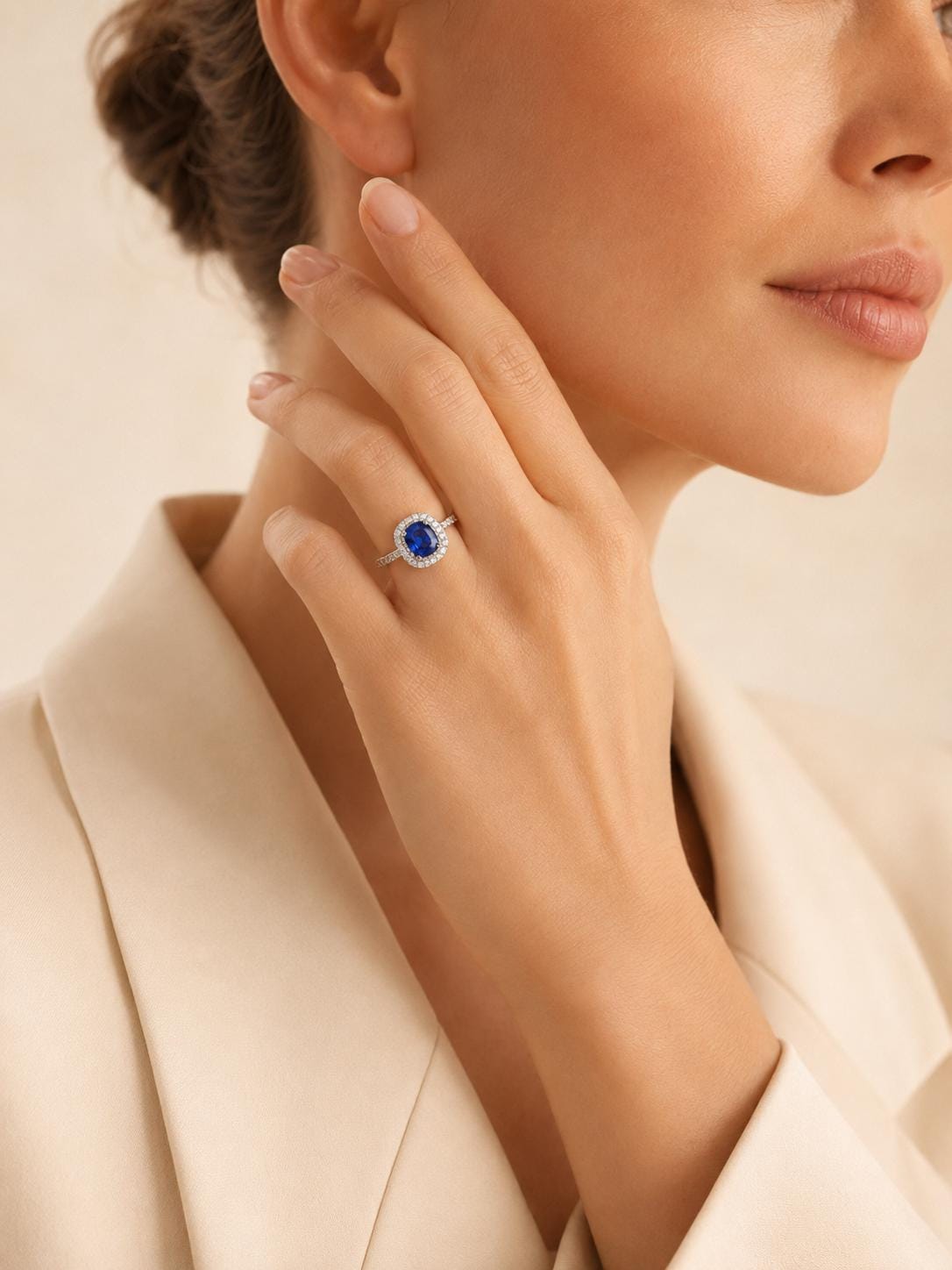 deep blue sapphire and diamond halo ring in PT950 platinum angled view