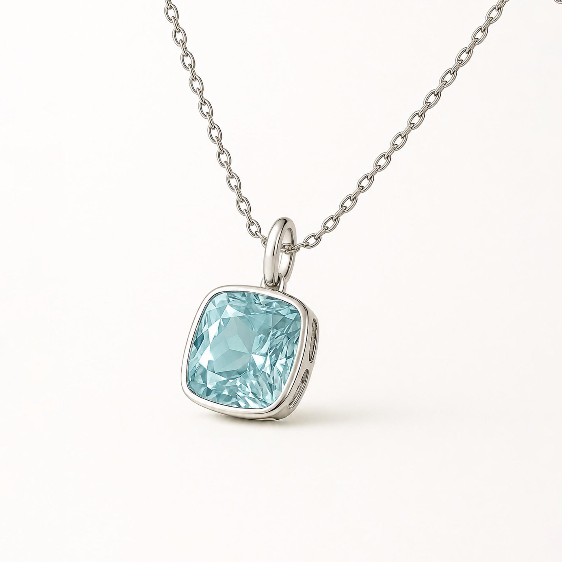 Front view of cushion blue topaz pendant with plain platinum oval bail
