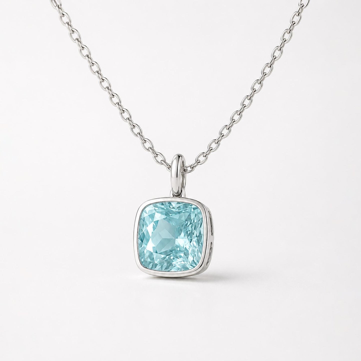 Close front view of blue topaz pendant with plain oval bail