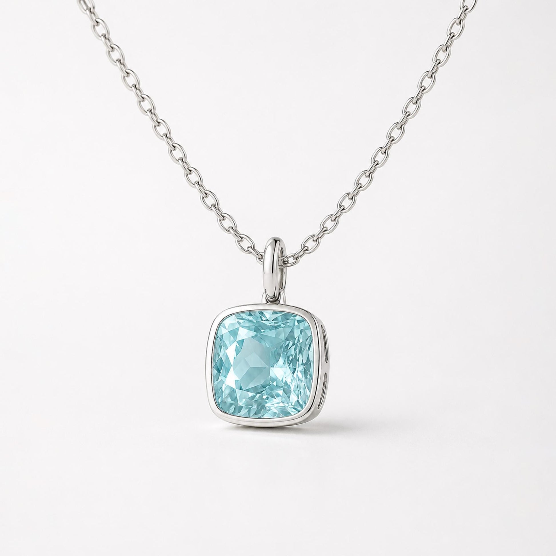 Close front view of blue topaz pendant with plain oval bail