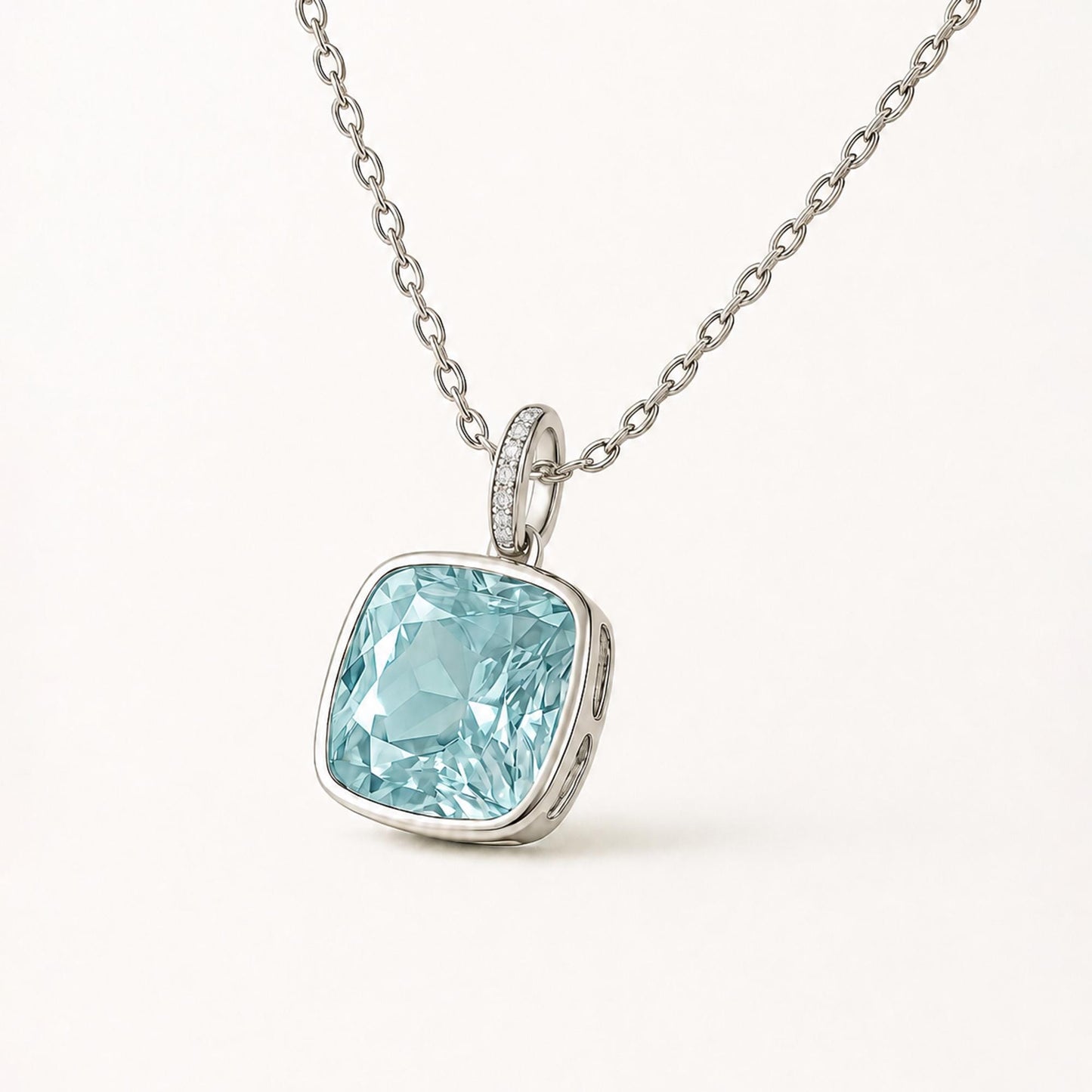 Cushion-cut blue topaz pendant in PT950 platinum with diamond-set oval bail