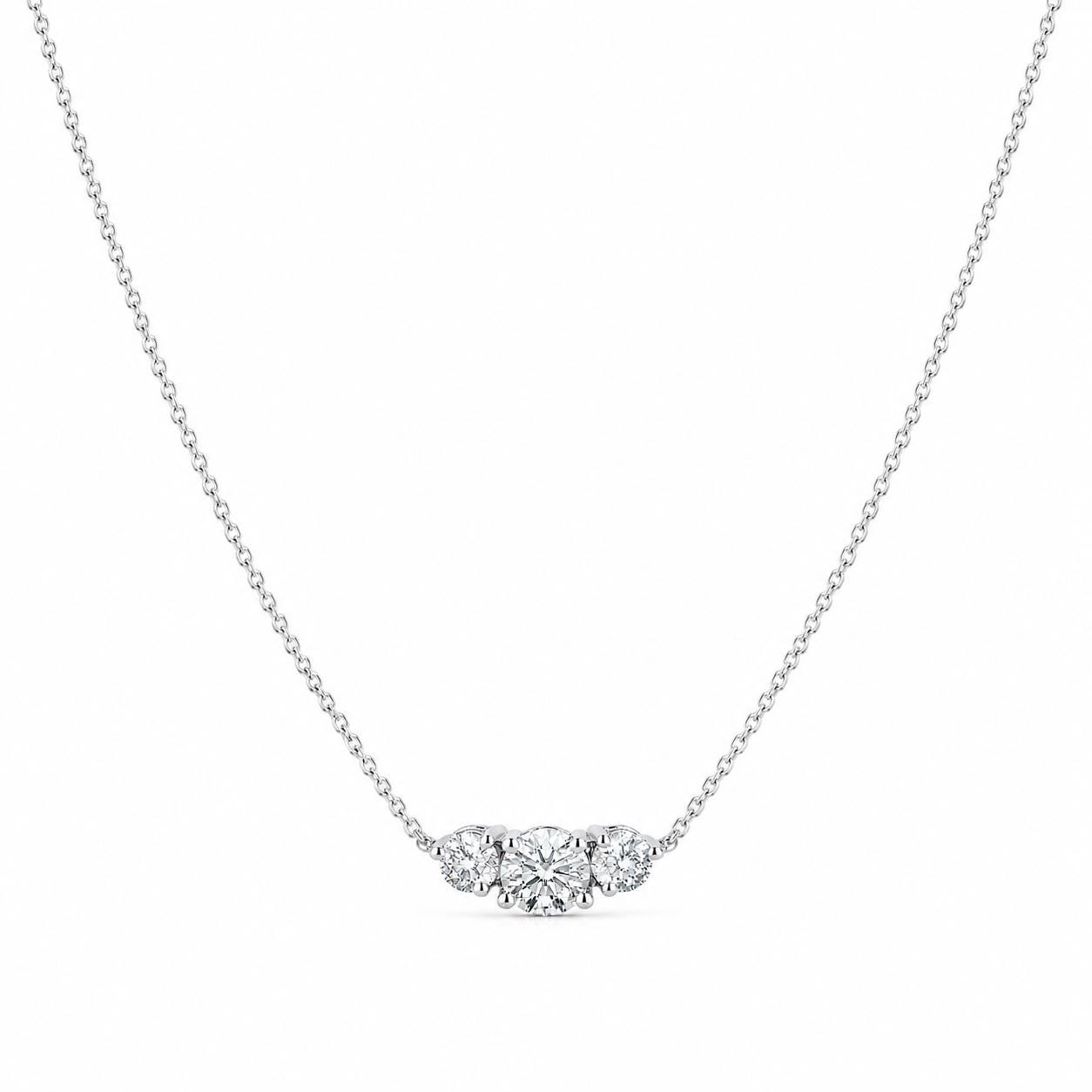 Full platinum three-stone lab diamond necklace arranged on white