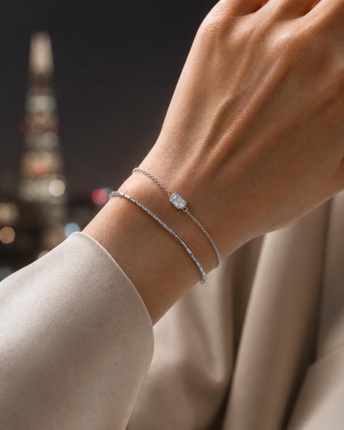 Emerald-cut lab diamond bracelet layered on wrist