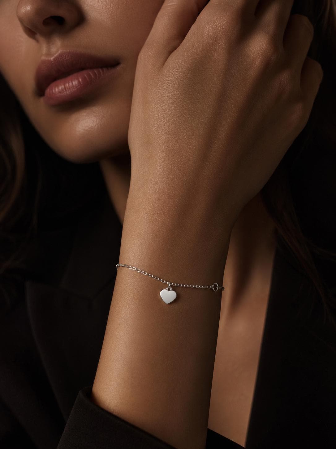 Woman wearing personalised platinum heart bracelet