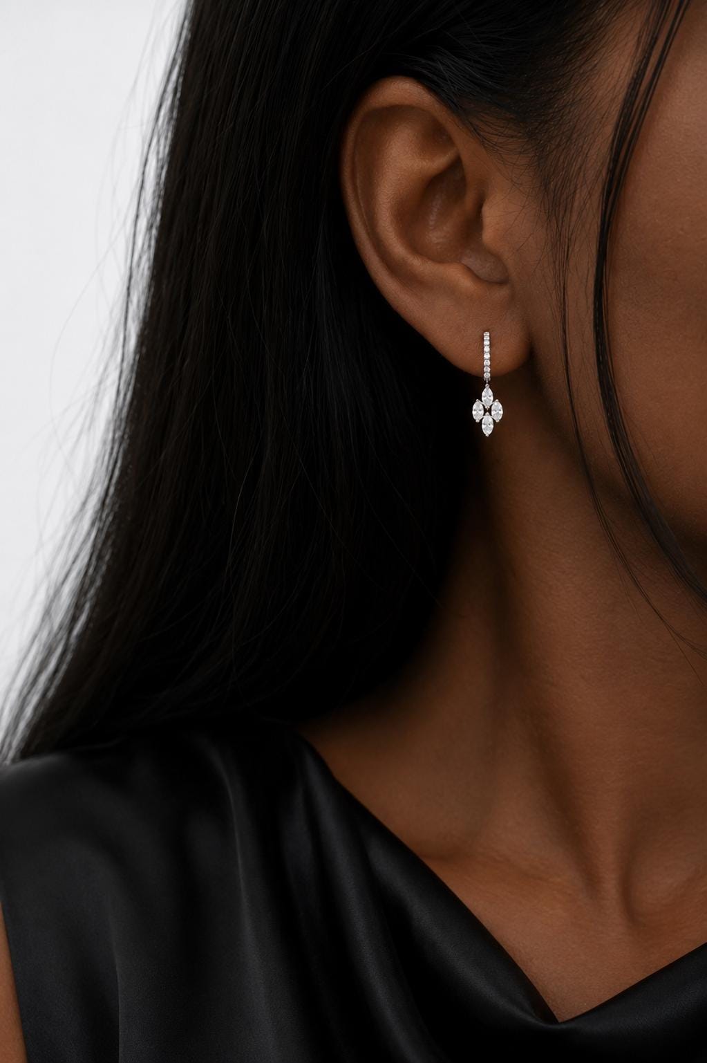 Model wearing 18K white gold marquise cluster drop earrings