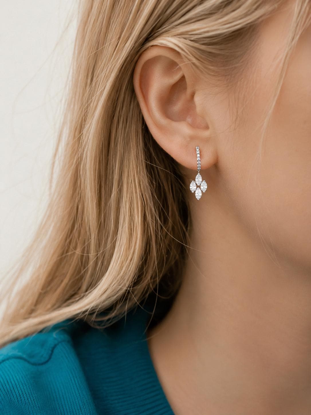Close ear view of marquise lab diamond drop earrings