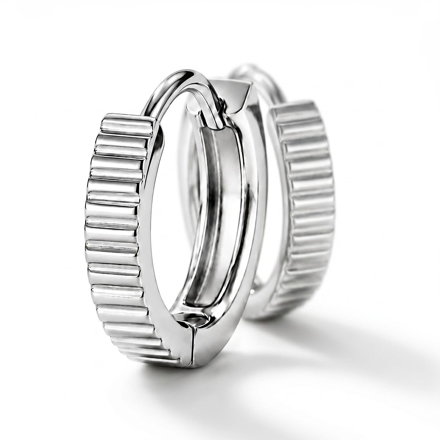 Solid PT950 ridged huggie hoop earrings on white
