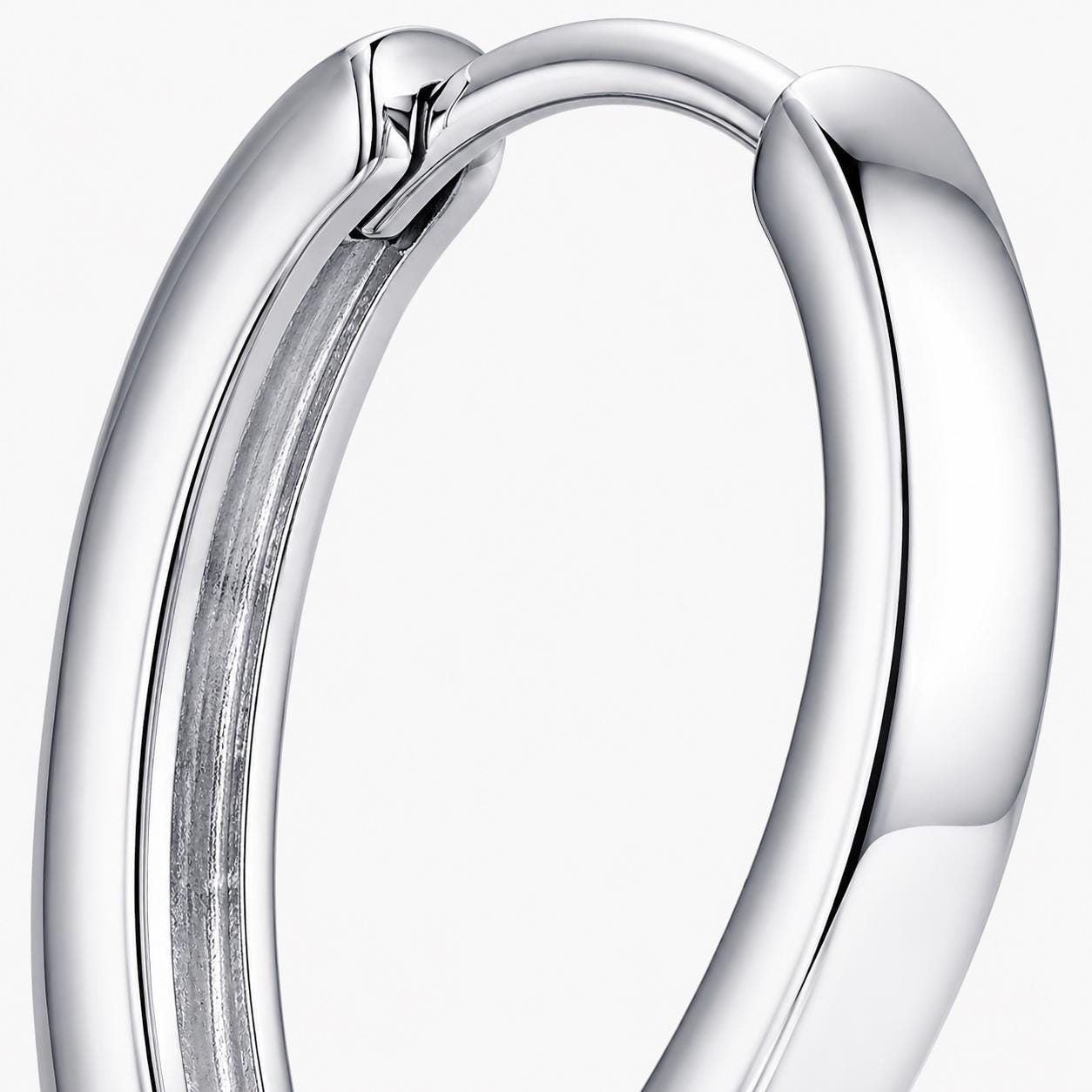 Macro view of the hinged clasp on a PT950 teardrop huggie