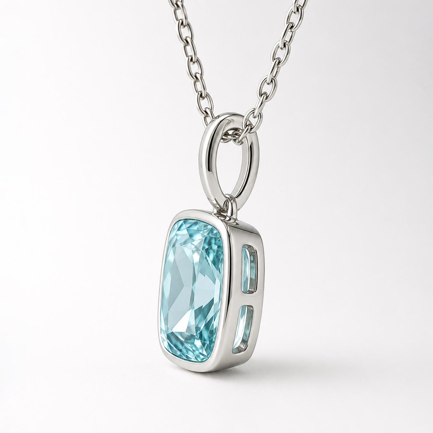 Opposite side view of cushion blue topaz pendant in PT950 platinum