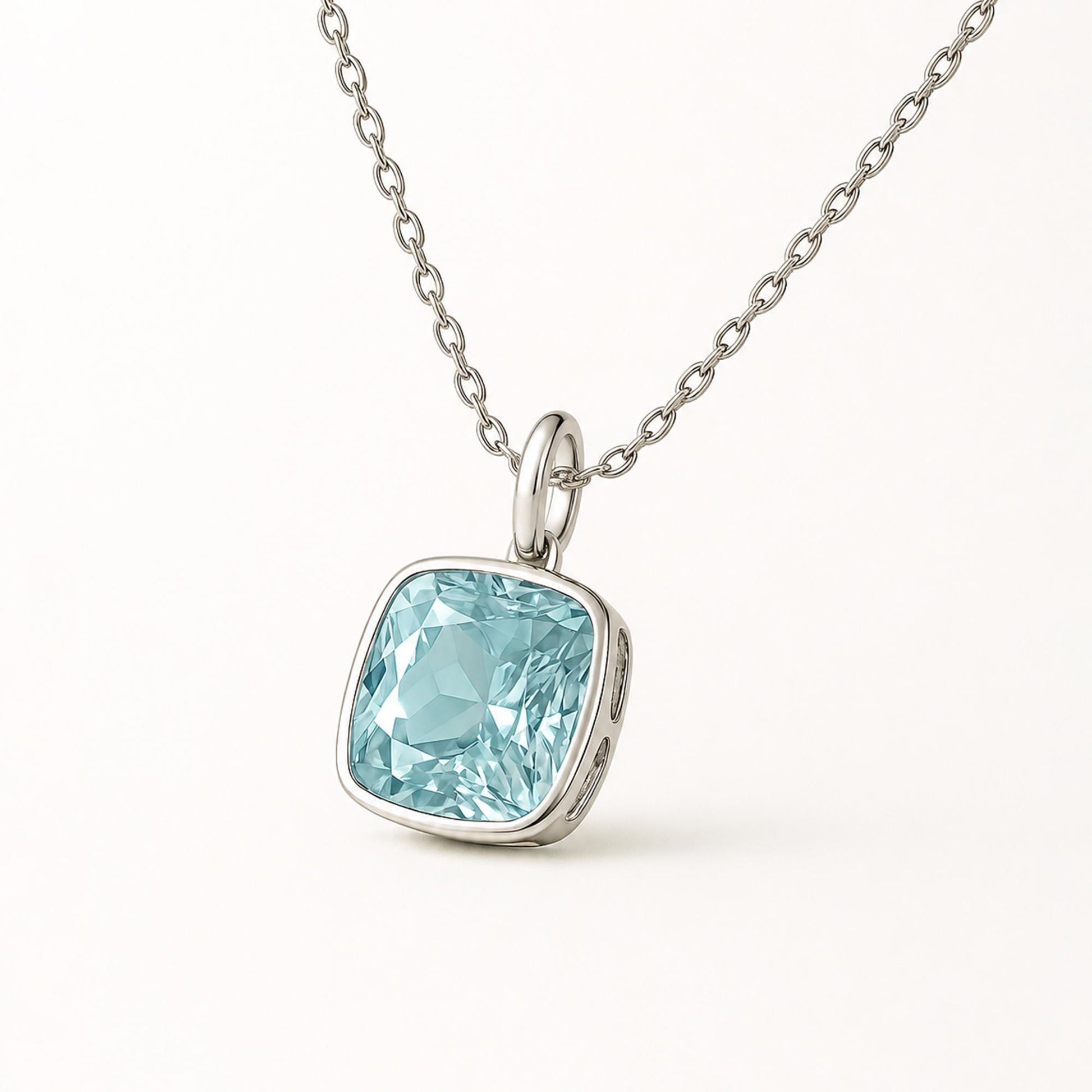 Angled view of cushion-cut blue topaz and plain platinum bail