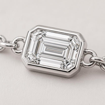 Macro detail of full bezel emerald-cut diamond setting