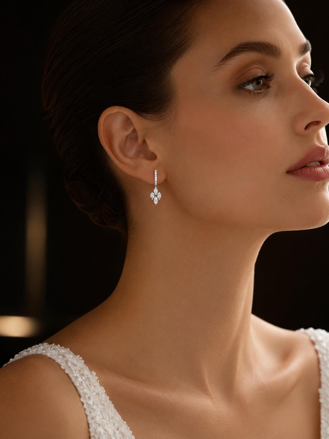 Bride wearing 18K white gold marquise diamond drop earrings