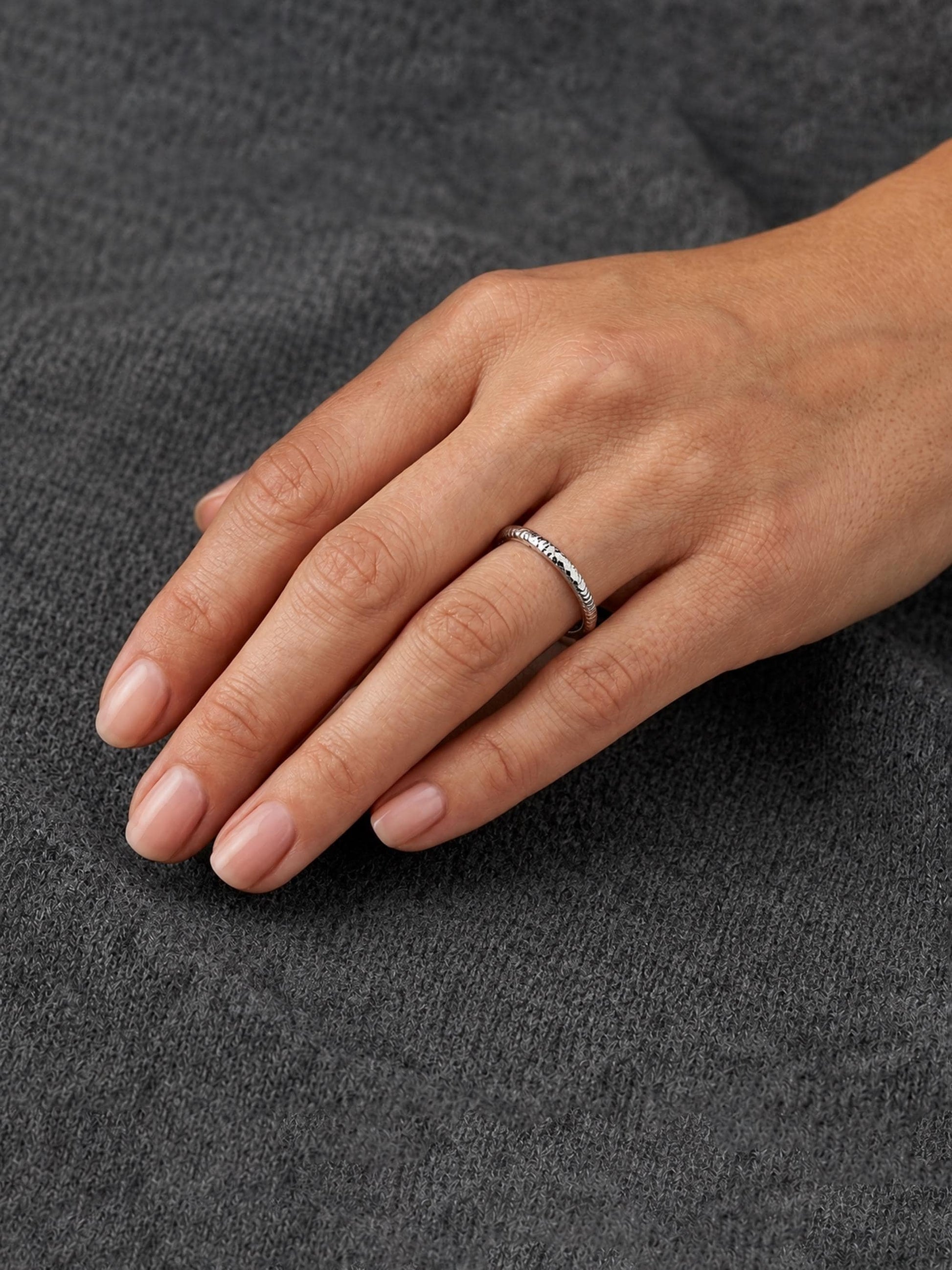 PT950 platinum faceted slim wedding band 2mm angled view