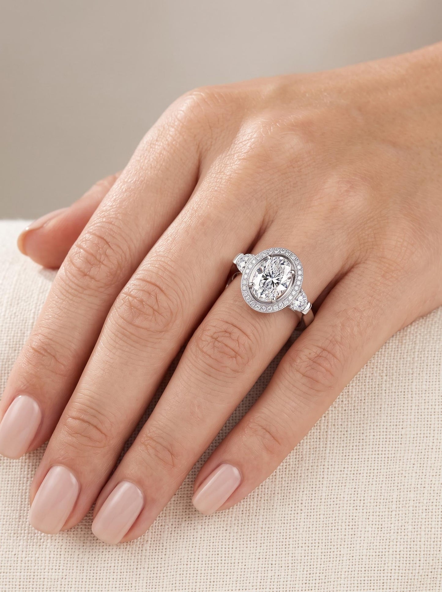 2.75ct oval lab diamond halo ring in PT950 platinum angled view