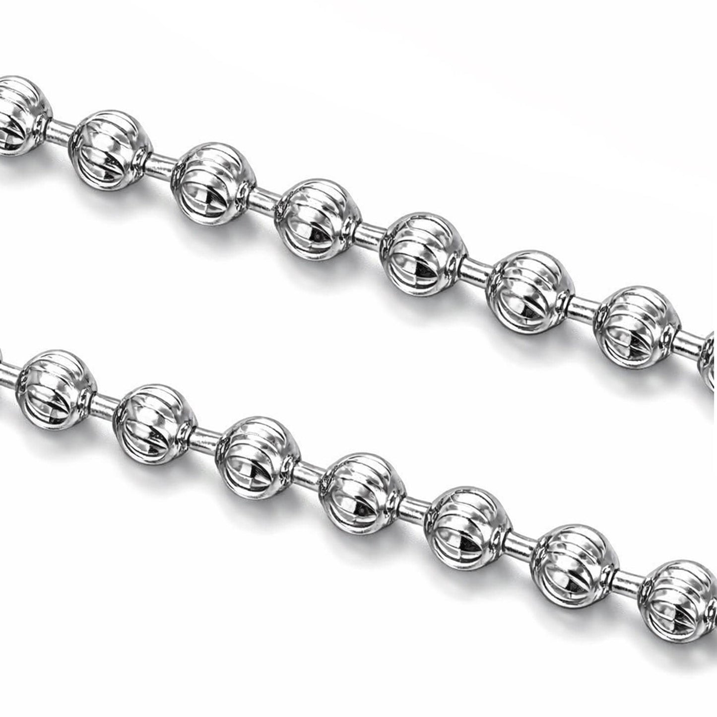 Macro detail of 1.5mm diamond-cut platinum beads with faceted surfaces
