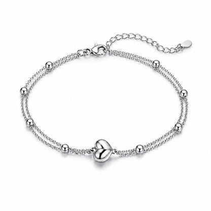 Solid PT950 platinum double-chain heart bracelet on white