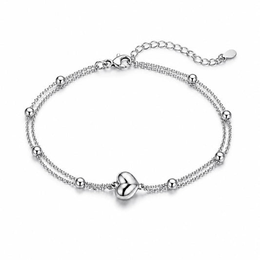 Solid PT950 platinum double-chain heart bracelet on white