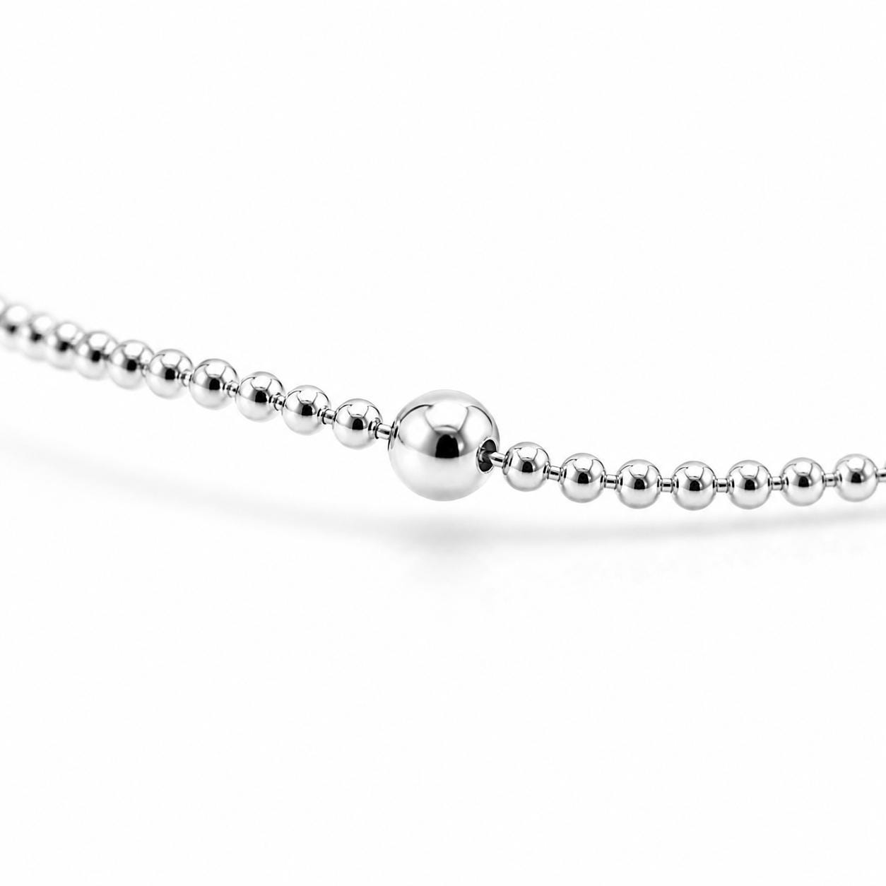 Macro detail of polished 2.4mm platinum station bead and bead chain