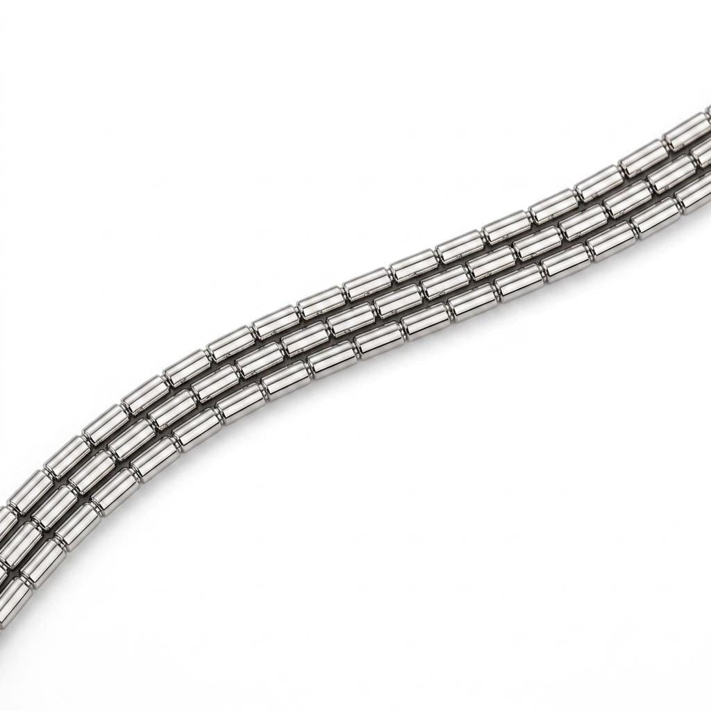 Macro detail of three faceted platinum chain strands