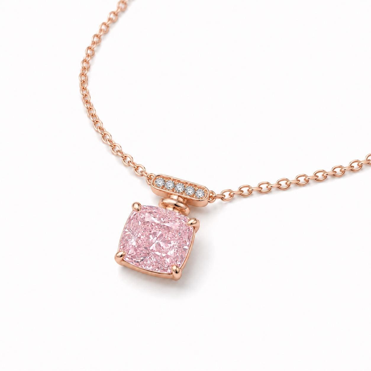 Angled view of 18K rose gold pink lab-grown diamond pendant on white