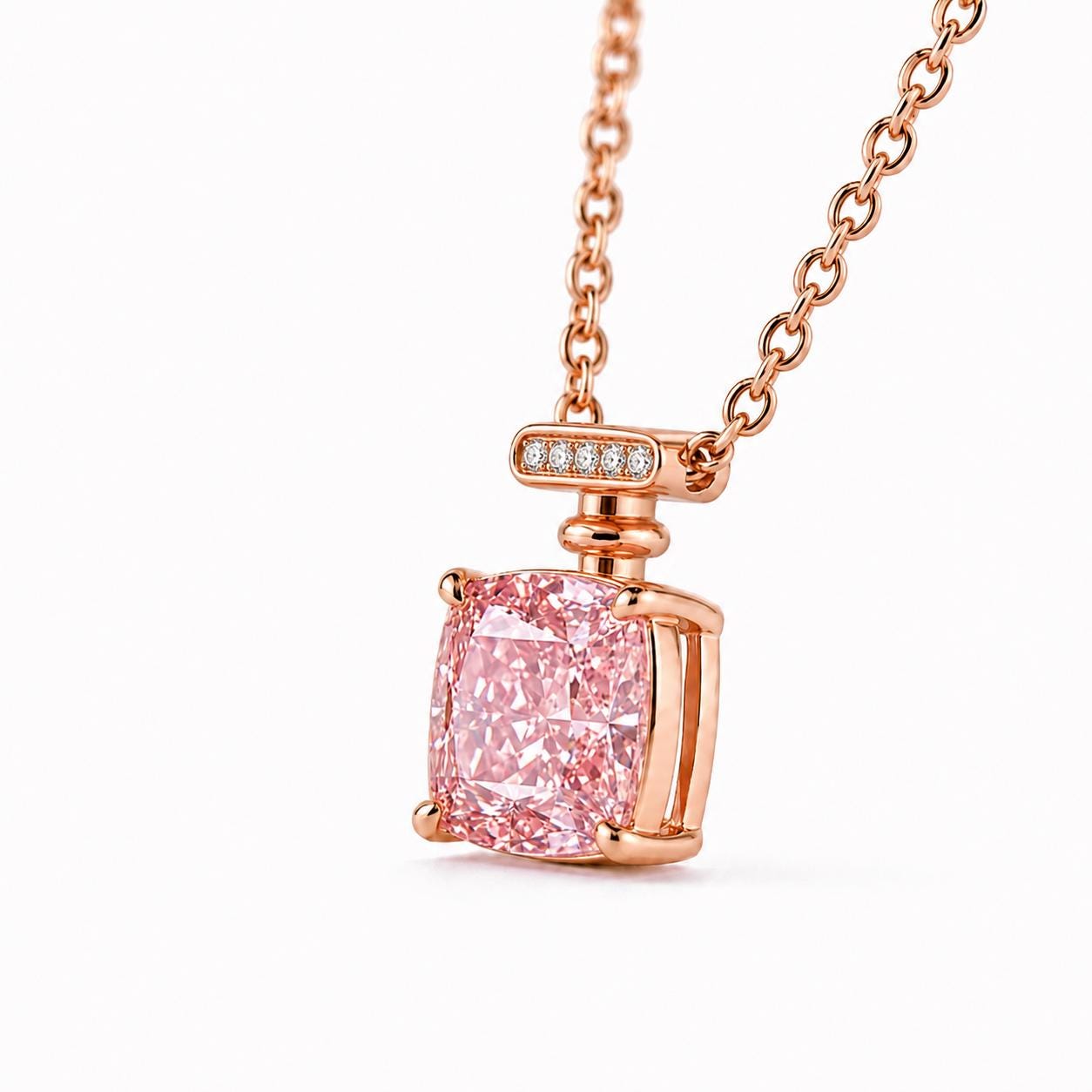 Side view of four-prong pink diamond setting and rose gold gallery