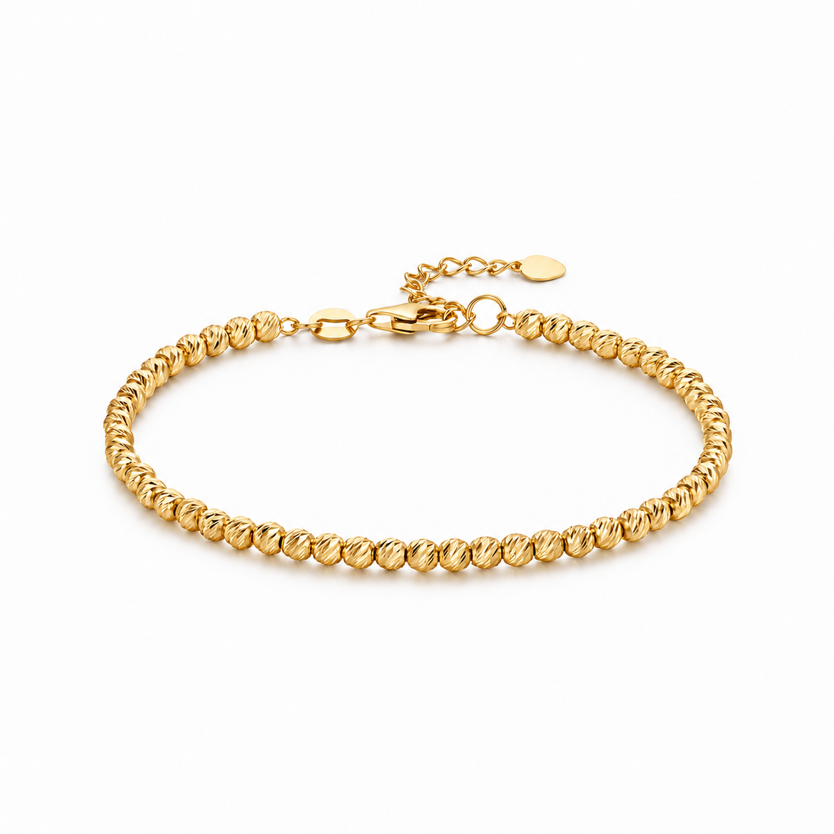 HELIOR Lustre 18K yellow gold bracelet with 3mm diamond-cut beads, lobster clasp and extension chain on a white background.